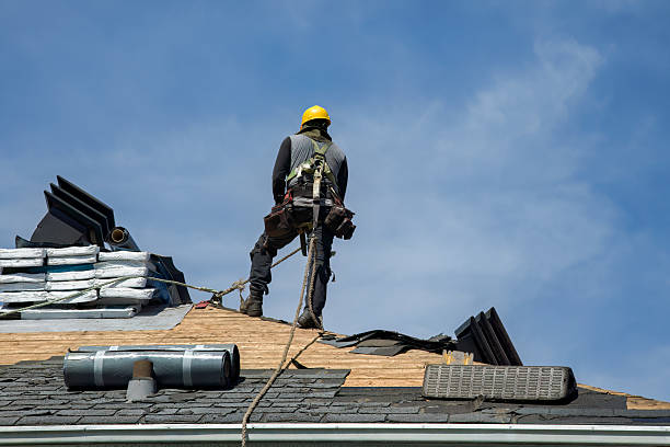 Professional Roof Replacement technician working in Harvey, ND